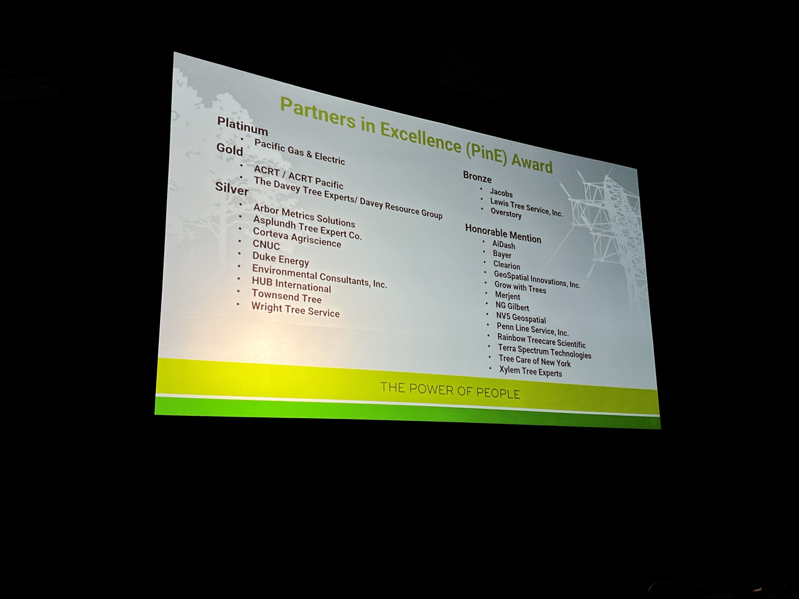 Slide from a presentation showing the “Partners in Excellence (PiNE) Award” winners with ACRT / ACRT Pacific listed under the Gold category.